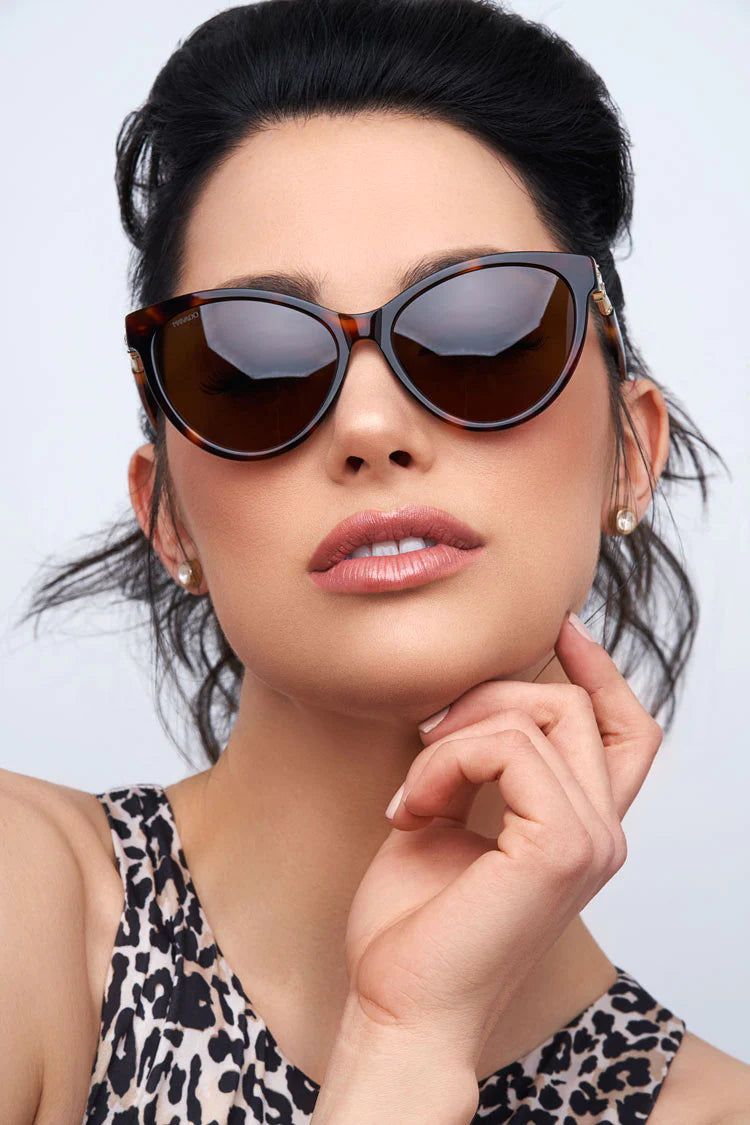 woman wearing brown tortoiseshell sunglasses