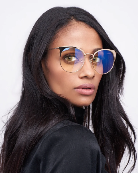 Woman wearing round blue light glasses