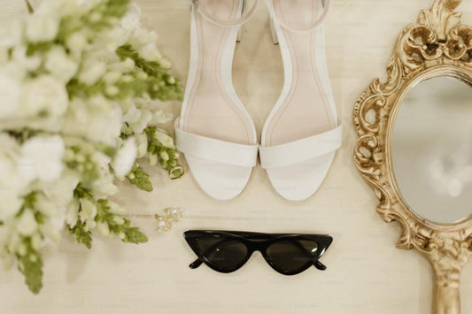 Cat eye sunglasses and white wedding shoes