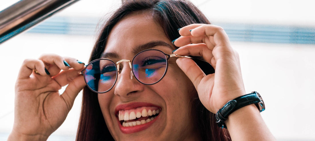 woman smiling wearing prescription glasses