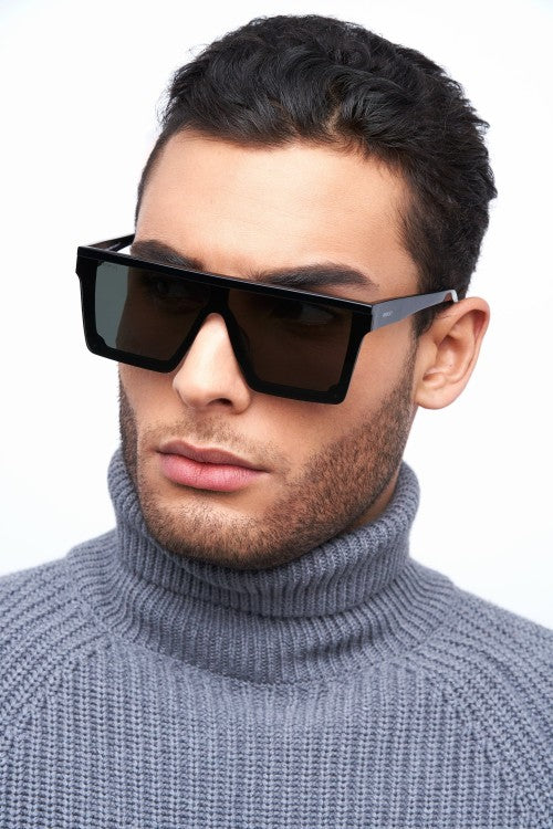 man in grey sweater and dark square sunglasses