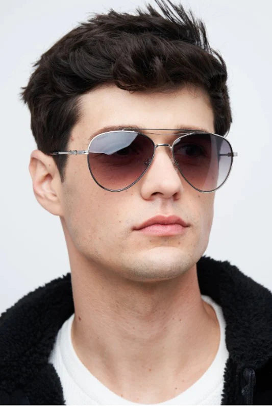 Man with a square face shape wearing aviator sunglasses