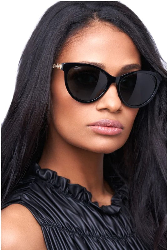 woman wearing dark cat eye sunglasses