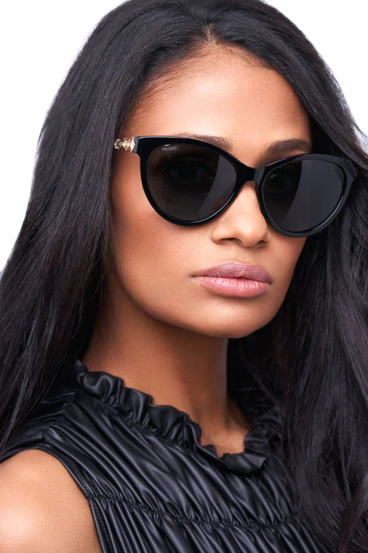 woman wearing full-frame black cat eye sunglasses
