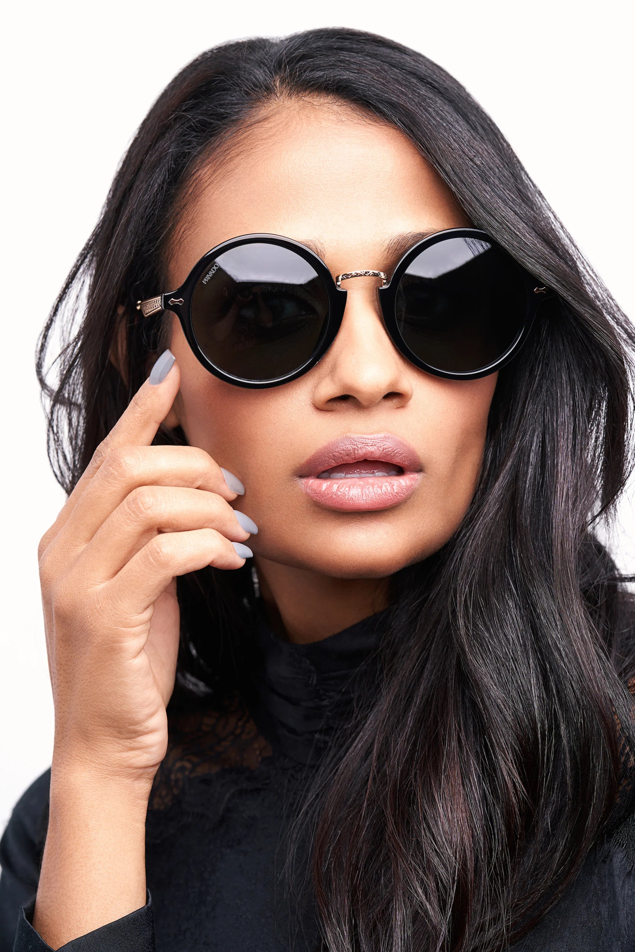 woman wearing round black polarized sunglasses